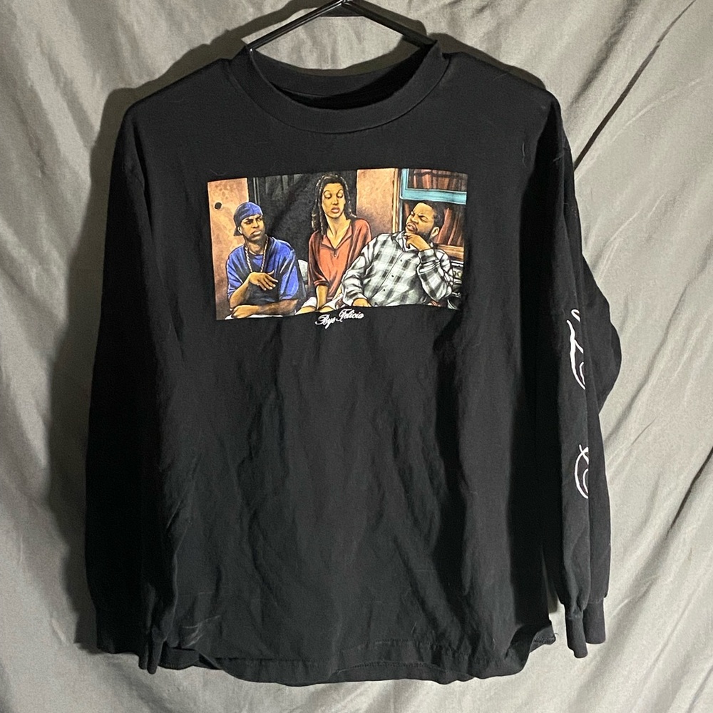 a black long sleeve bye felicia shirt.